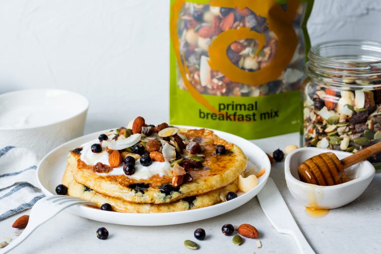 fluffy blueberry pancakes topped with primal breakfast mix